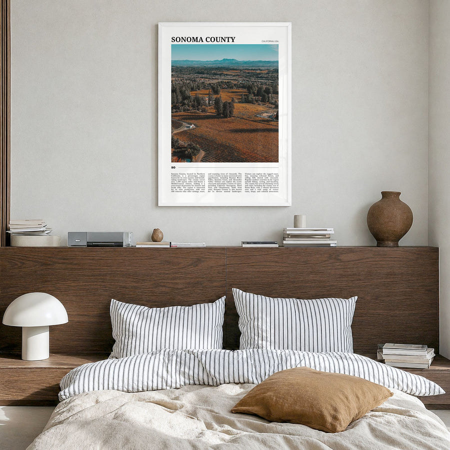 Sonoma County Travel Poster in a white wood frame, hanging in a bedroom