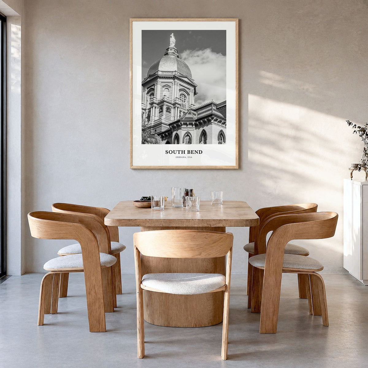 South Bend Classic Poster in a natural wood frame, hanging in a dining room