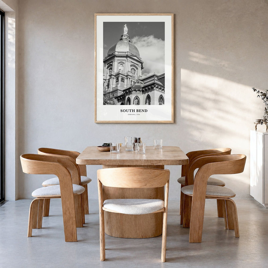 South Bend Classic Poster in a natural wood frame, hanging in a dining room