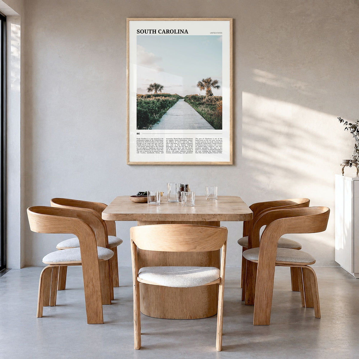 South Carolina Travel No 1 Poster in a natural wood frame, hanging in a dining room