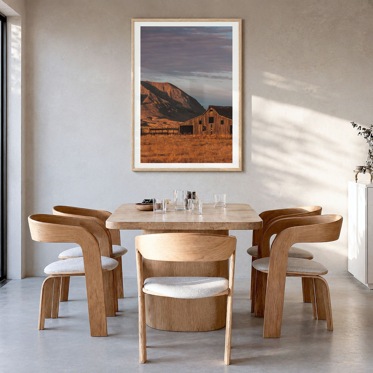 South Dakota Photo Poster in a natural wood frame, hanging in a dining room, white border