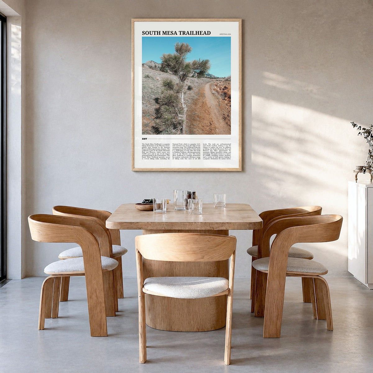 South Mesa Trailhead Travel Poster in a natural wood frame, hanging in a dining room