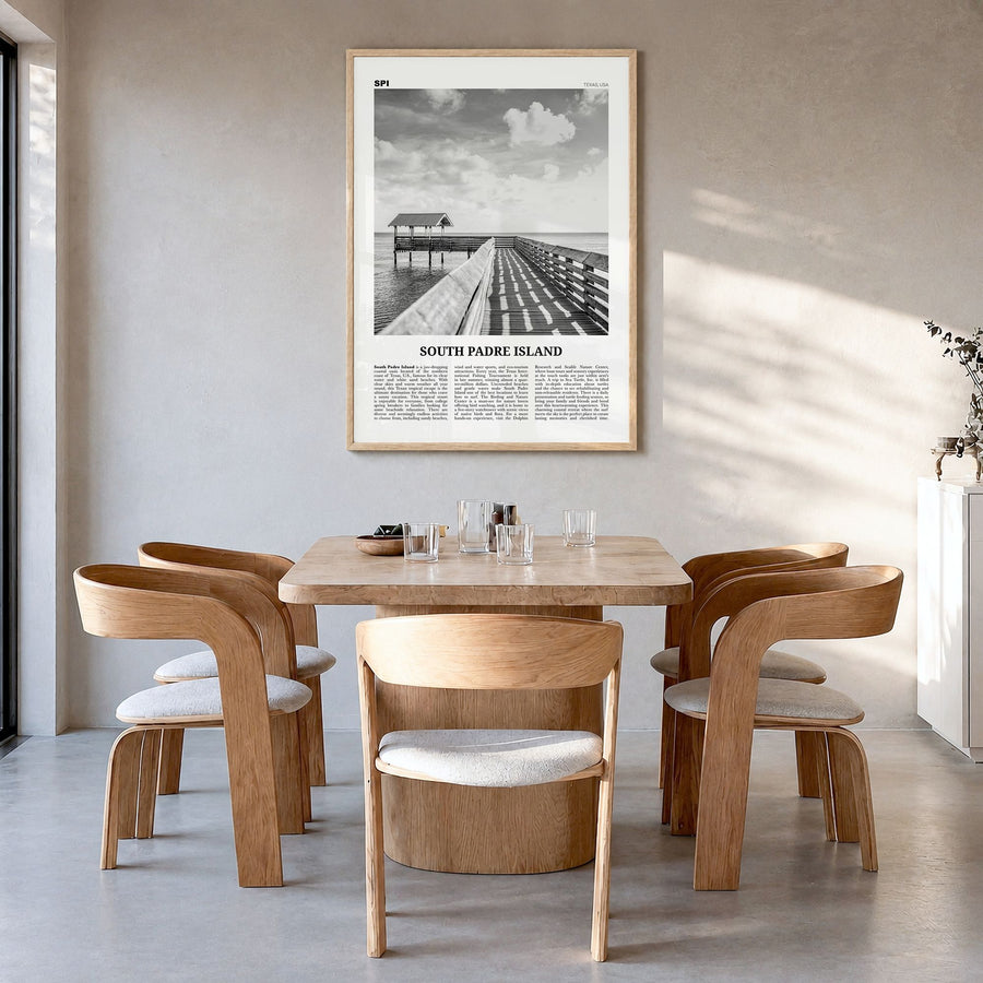 South Padre Island Newspaper Poster in a natural wood frame, hanging in a dining room