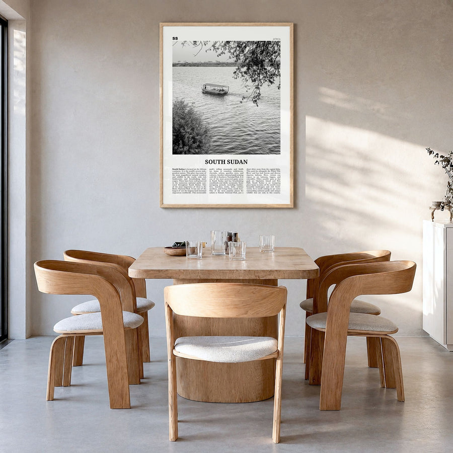 South Sudan Newspaper Poster in a natural wood frame, hanging in a dining room