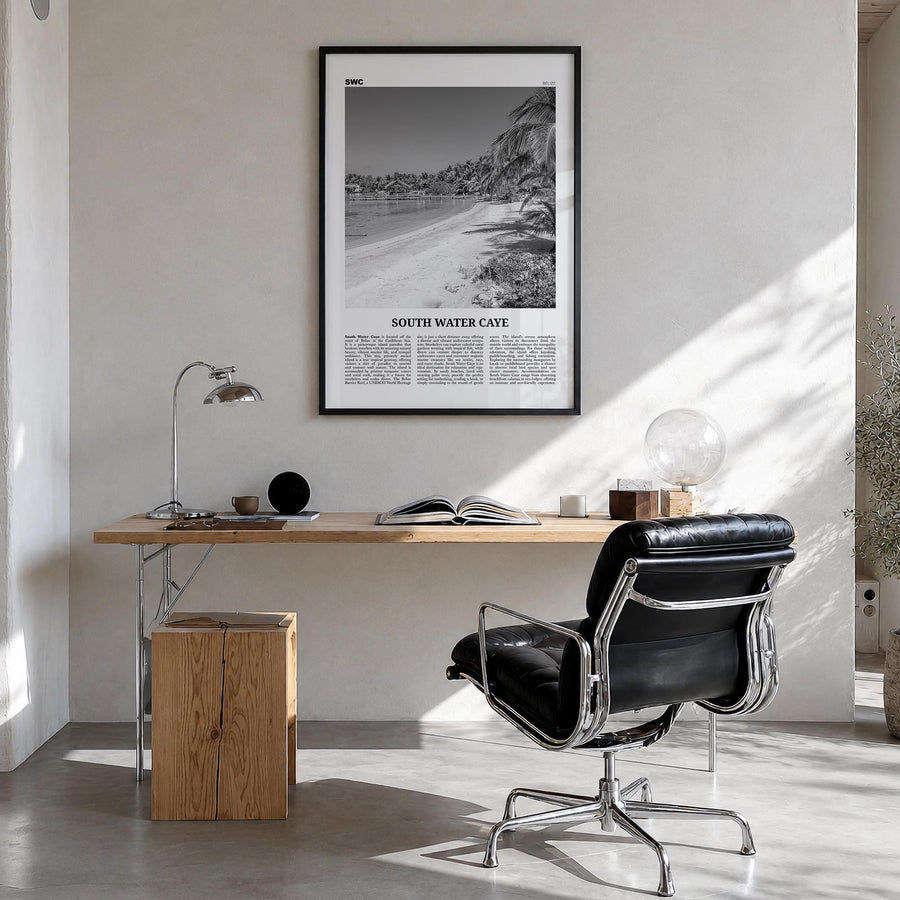 South Water Caye black & white newspaper poster of Belize – vertical wall art in black wood frame, hanging on wall