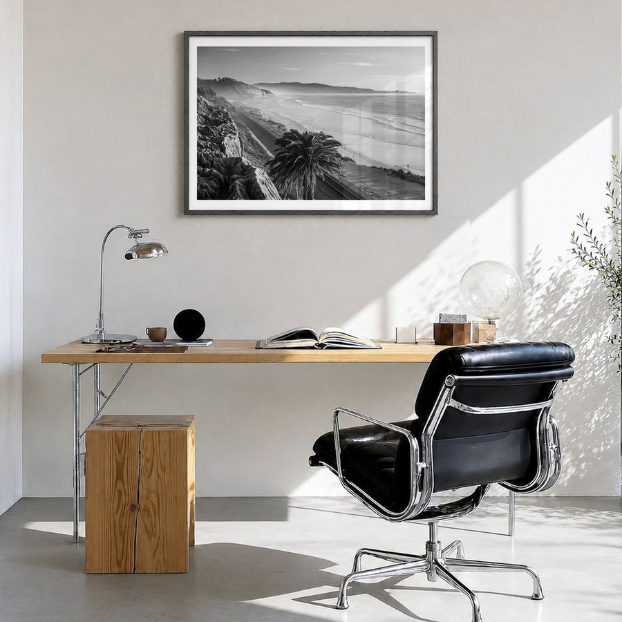 Southern California Photo Poster in a black wood frame, hanging in a bright home office, white border