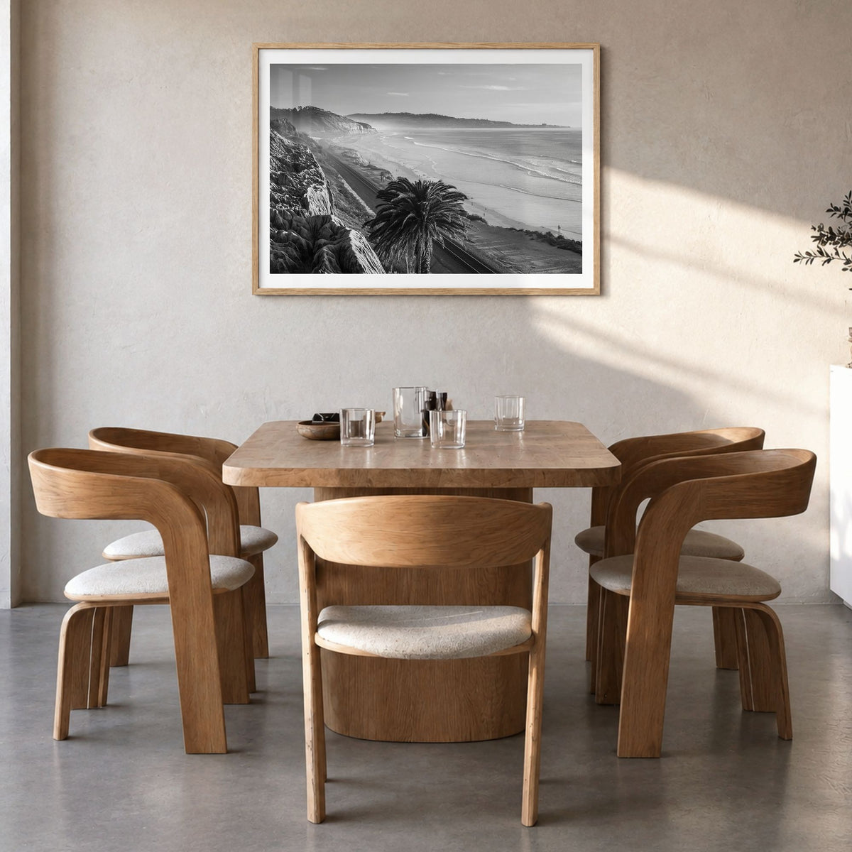 Southern California Photo Poster in a natural wood frame, hanging in a dining room, white border