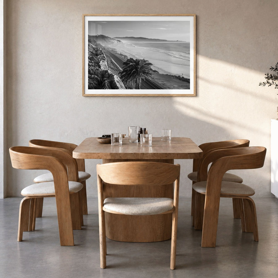 Southern California Photo Poster in a natural wood frame, hanging in a dining room, white border