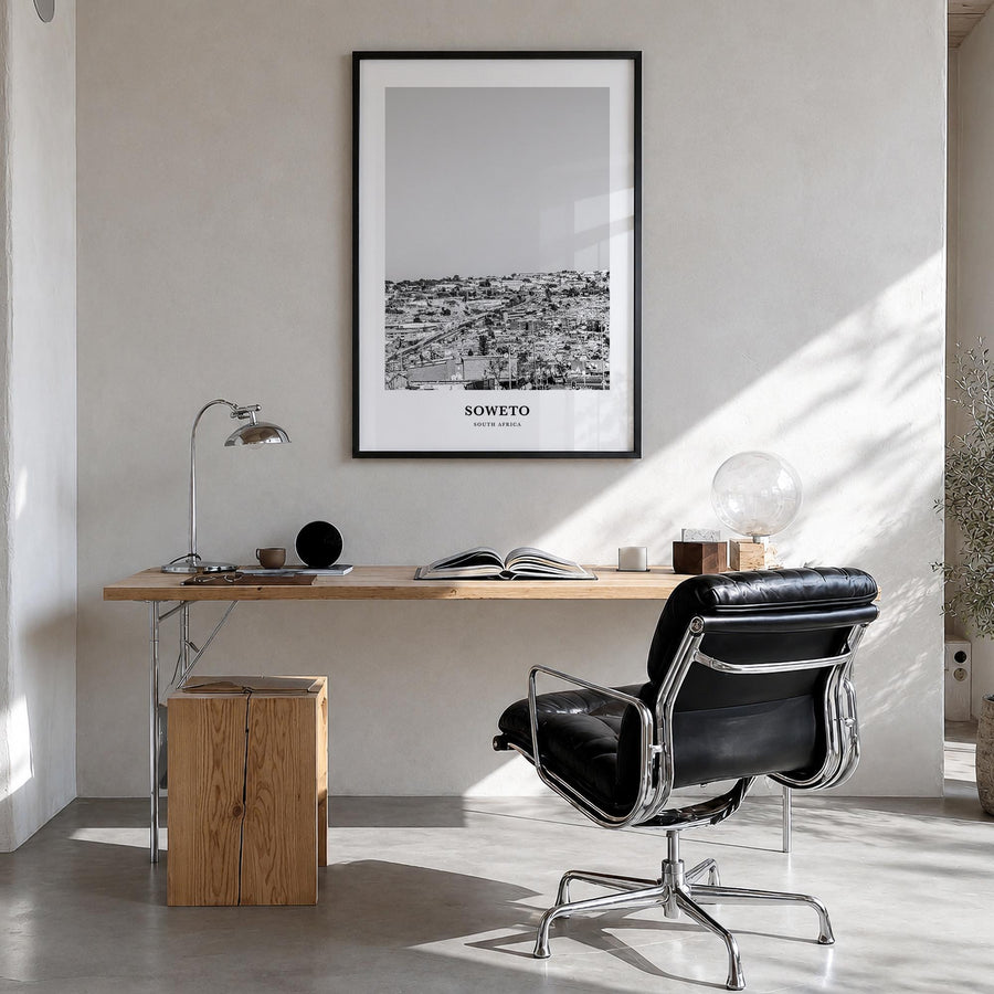 Soweto black & white classic poster of South Africa – vertical wall art in black wood frame, hanging on wall