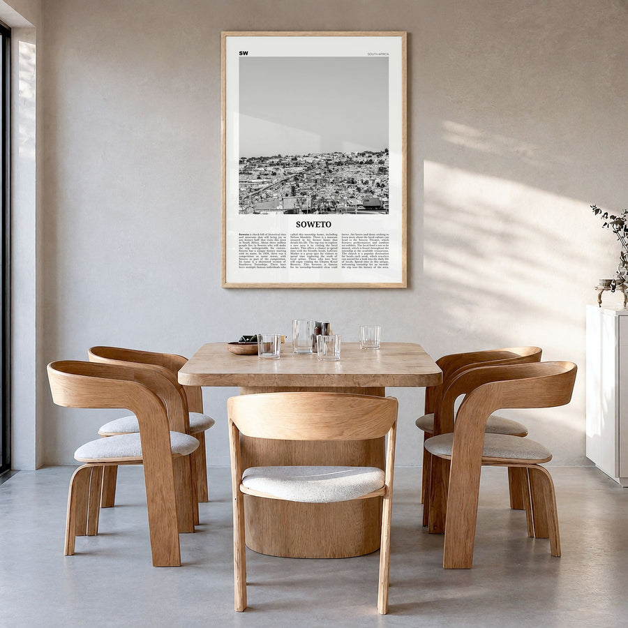 Soweto Newspaper Poster in a natural wood frame, hanging in a dining room