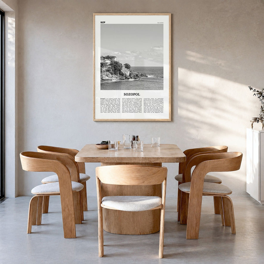 Sozopol Newspaper Poster in a natural wood frame, hanging in a dining room