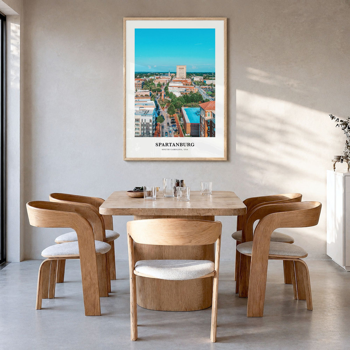 Spartanburg Classic Poster in a natural wood frame, hanging in a dining room