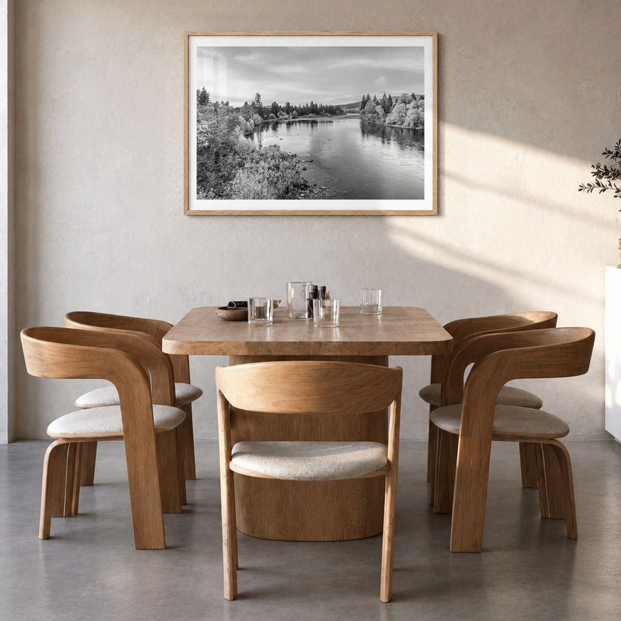 Spokane Photo Poster in a natural wood frame, hanging in a dining room, white border