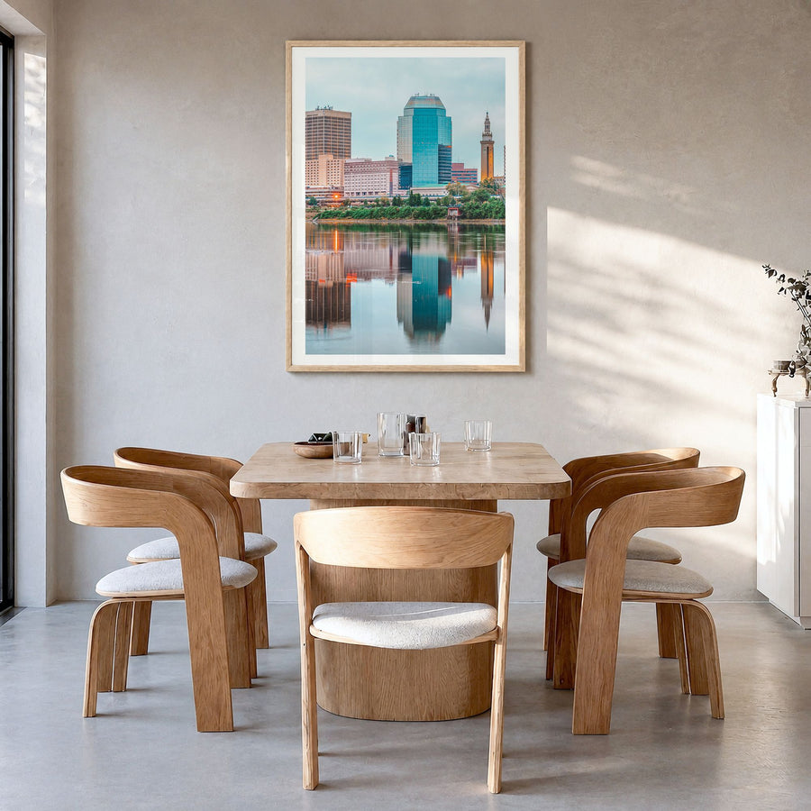 Springfield, Massachusetts Photo Poster in a natural wood frame, hanging in a dining room, white border