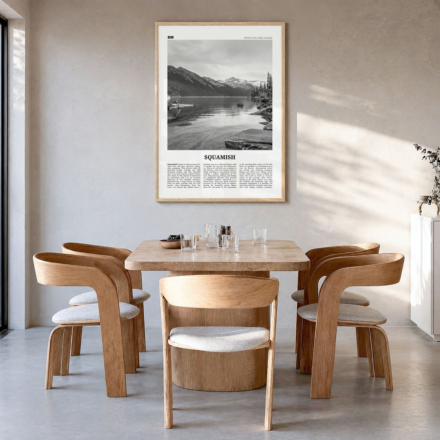 Squamish Newspaper Poster in a natural wood frame, hanging in a dining room