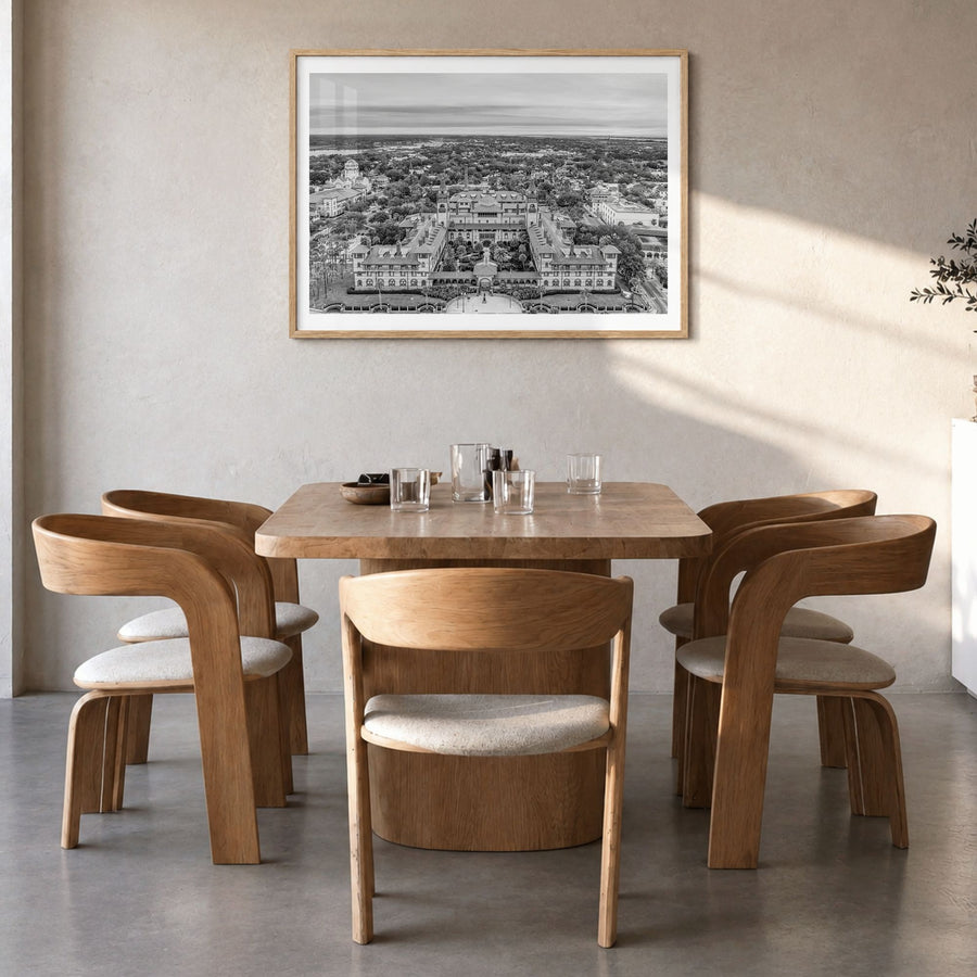 St. Augustine Photo Poster in a natural wood frame, hanging in a dining room, white border