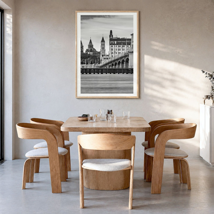 St. Augustine Photo Poster in a natural wood frame, hanging in a dining room, white border