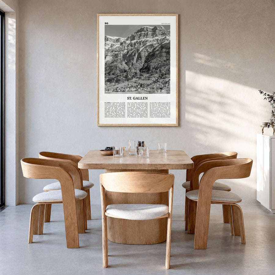 St. Gallen Newspaper Poster in a natural wood frame, hanging in a dining room