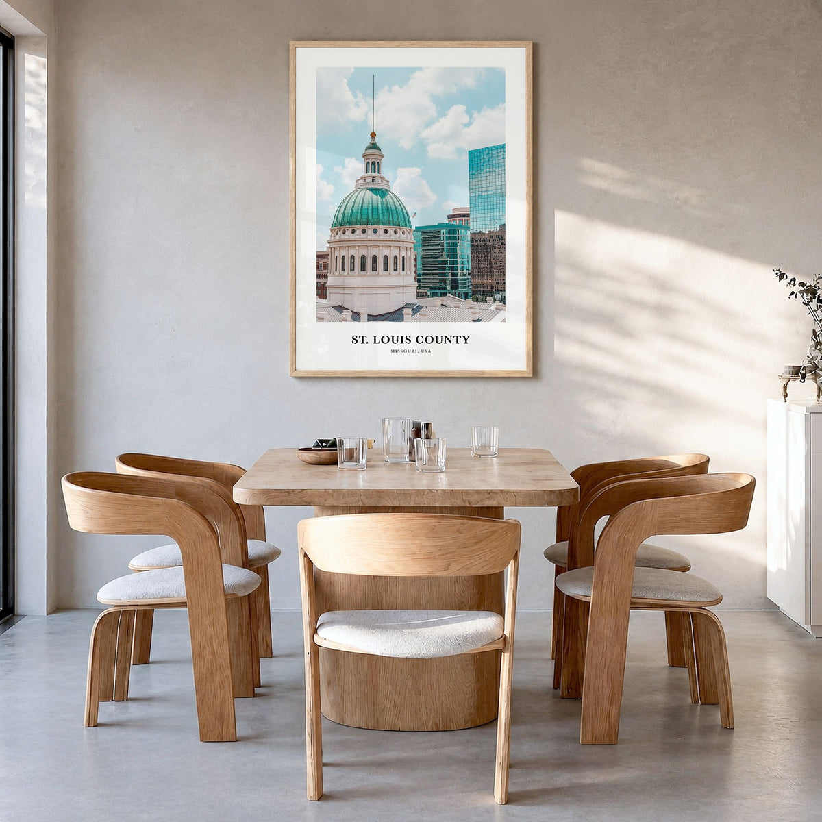 St. Louis County Classic Poster in a natural wood frame, hanging in a dining room