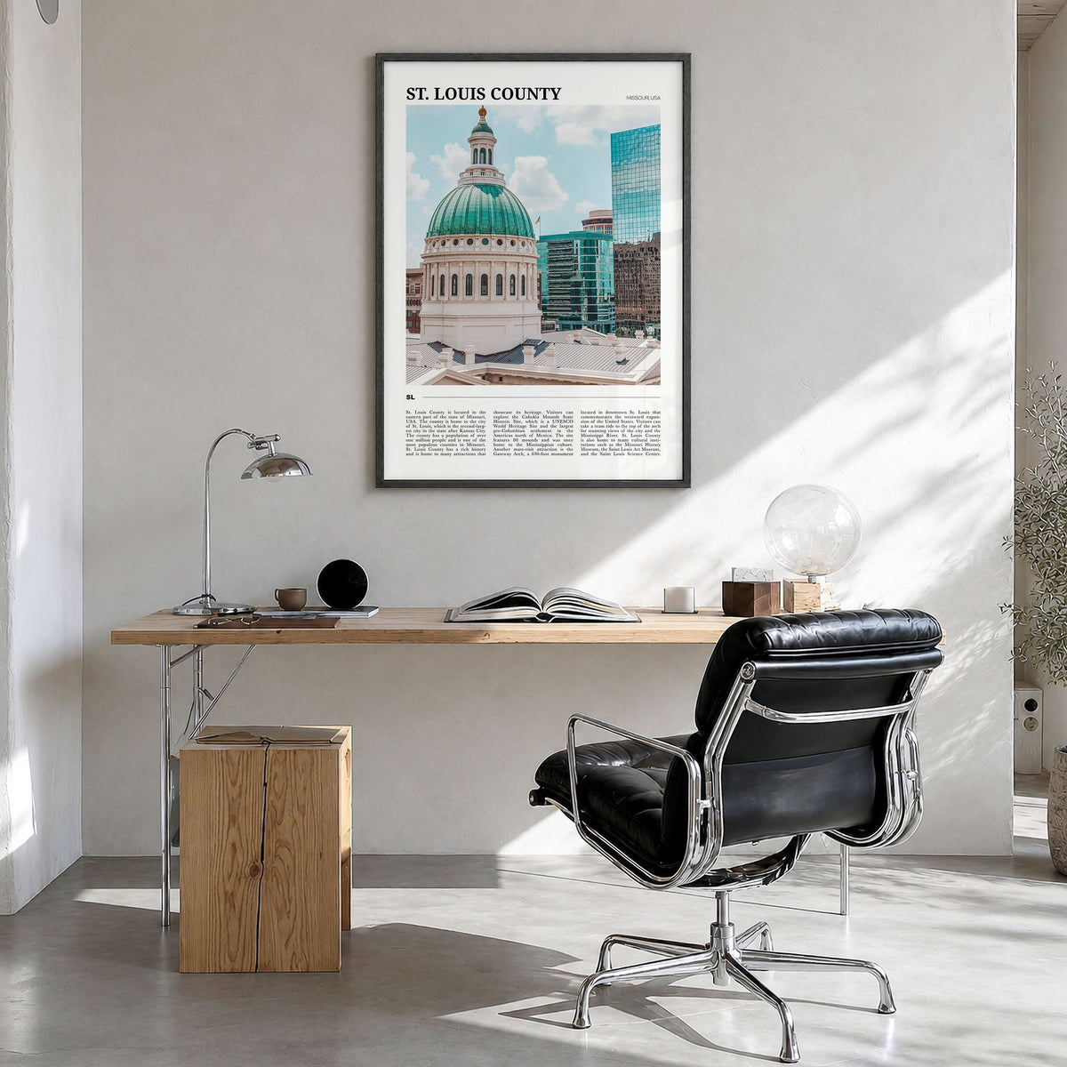 St. Louis County Travel Poster in a black wood frame, hanging in a bright home office