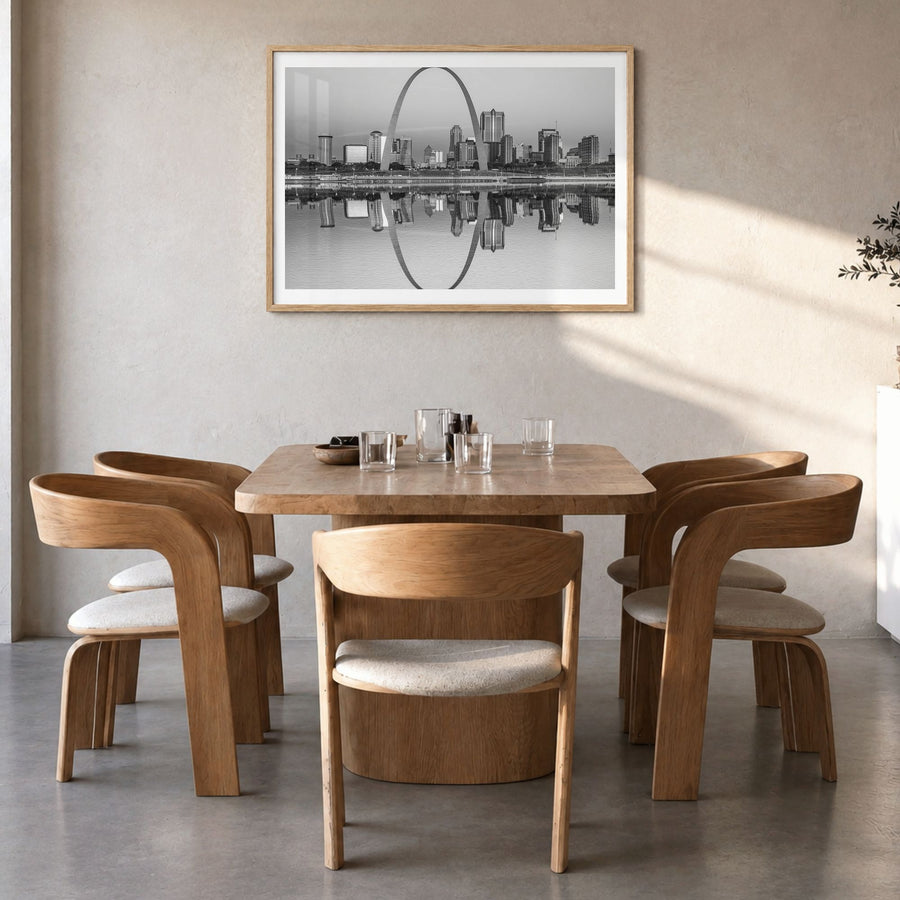 St. Louis Photo Poster in a natural wood frame, hanging in a dining room, white border