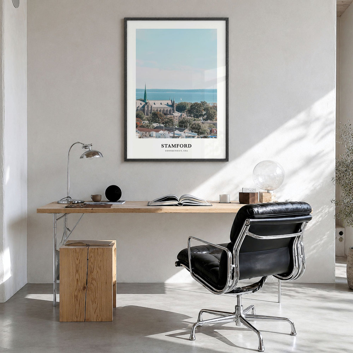 Stamford, Connecticut Classic Poster in a black wood frame, hanging in a bright home office