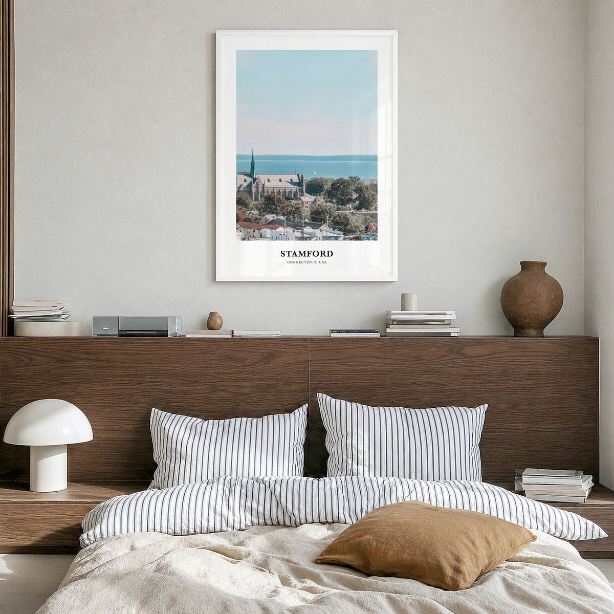 Stamford, Connecticut Classic Poster in a white wood frame, hanging in a bedroom