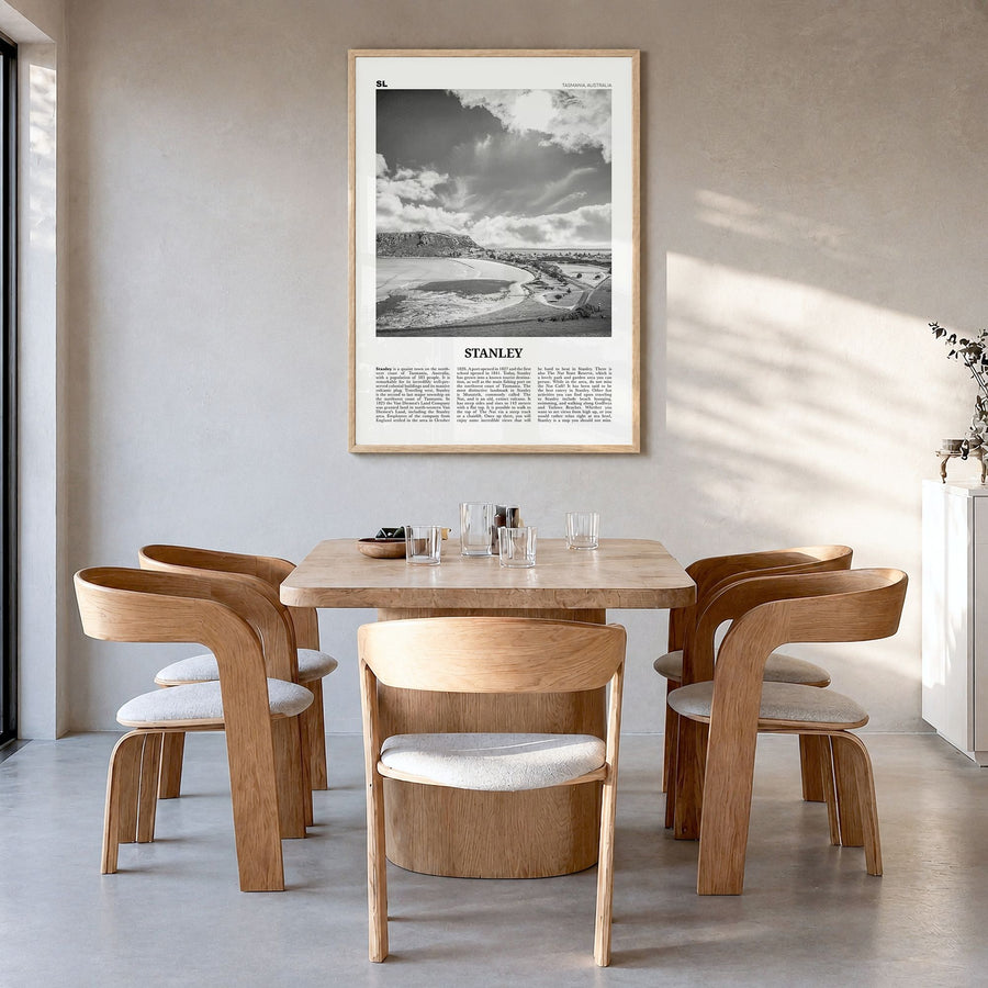 Stanley Newspaper Poster in a natural wood frame, hanging in a dining room