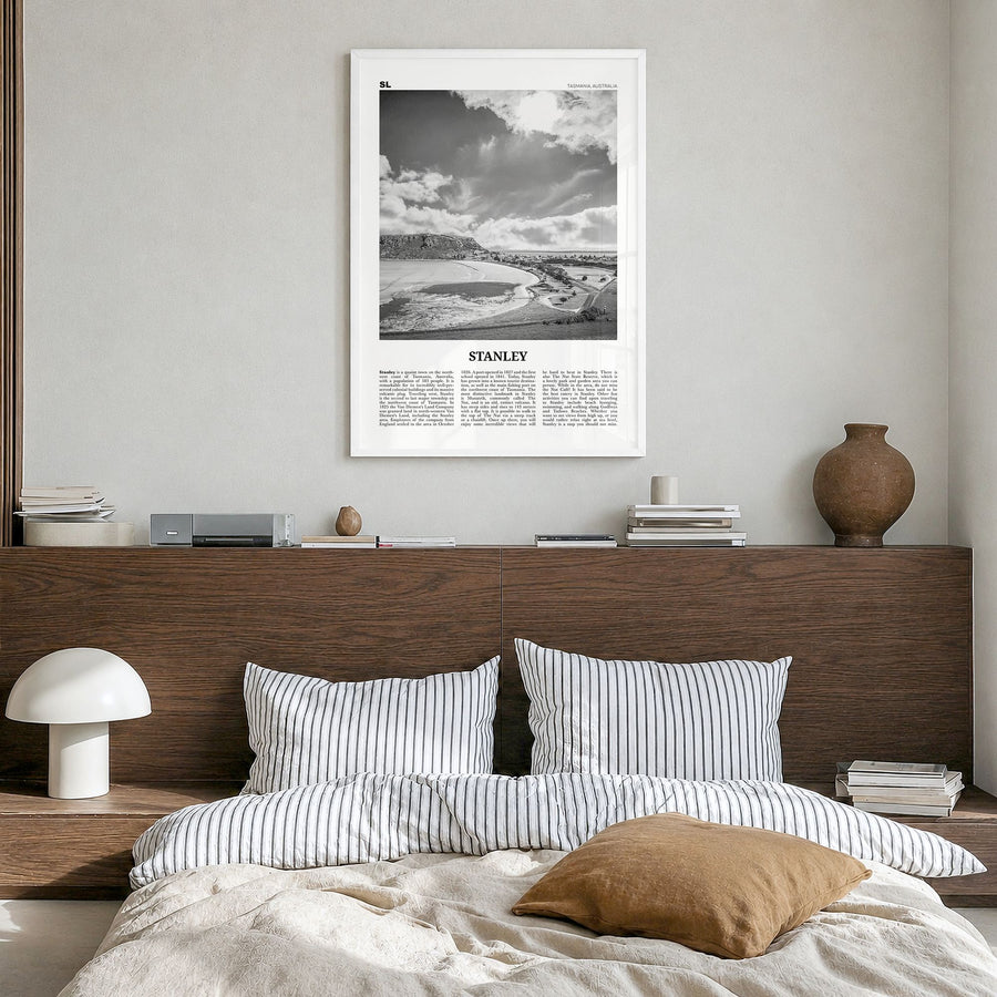 Stanley Newspaper Poster in a white wood frame, hanging in a bedroom