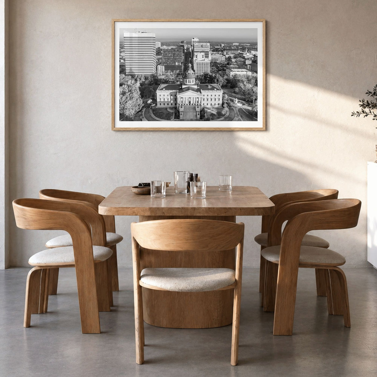 State College Photo Poster in a natural wood frame, hanging in a dining room, white border