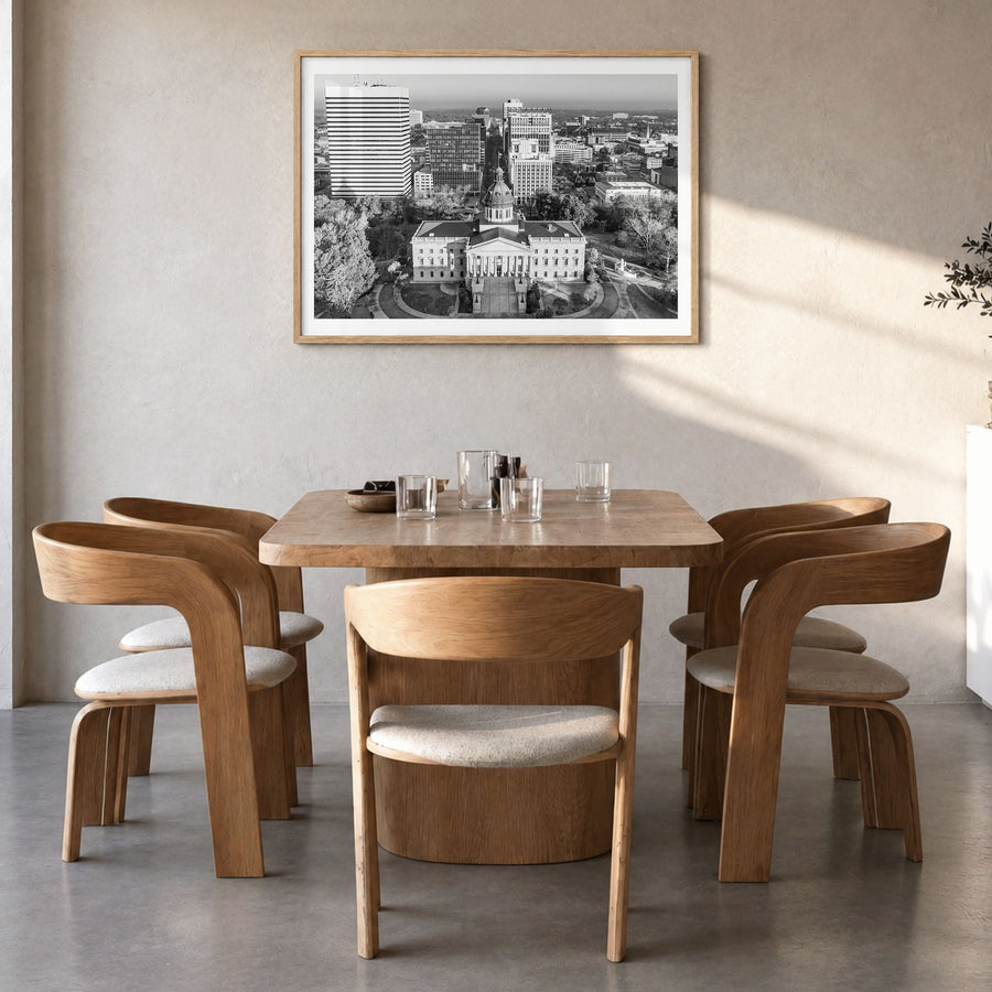 State College Photo Poster in a natural wood frame, hanging in a dining room, white border
