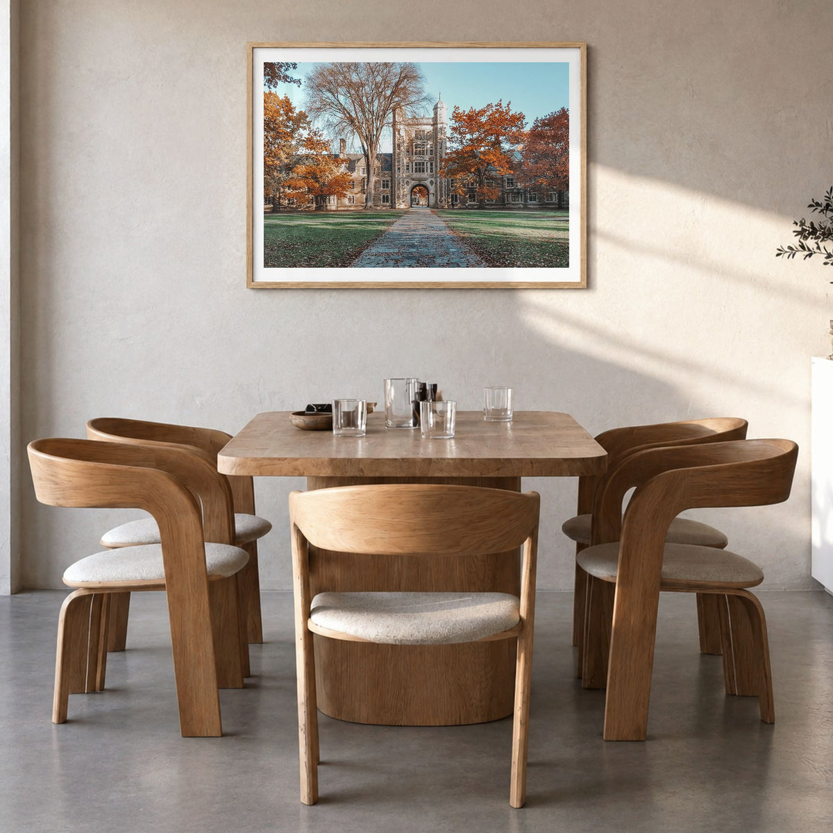 State College Photo Poster in a natural wood frame, hanging in a dining room, white border