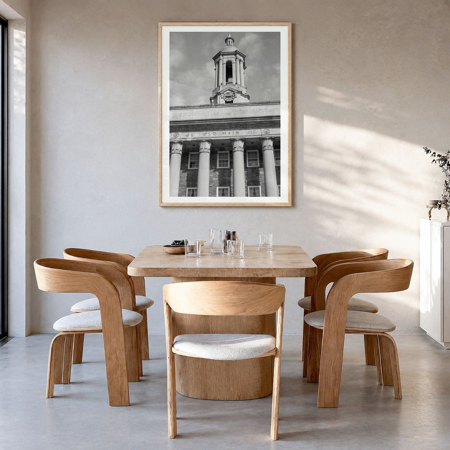State College Photo Poster in a natural wood frame, hanging in a dining room, white border