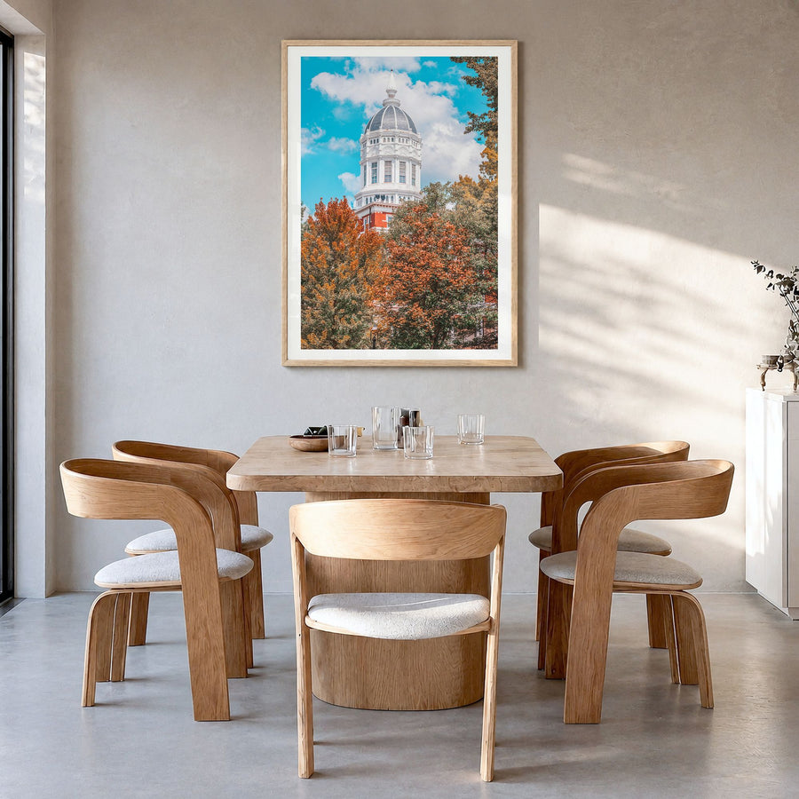 State College Photo Poster in a natural wood frame, hanging in a dining room, white border