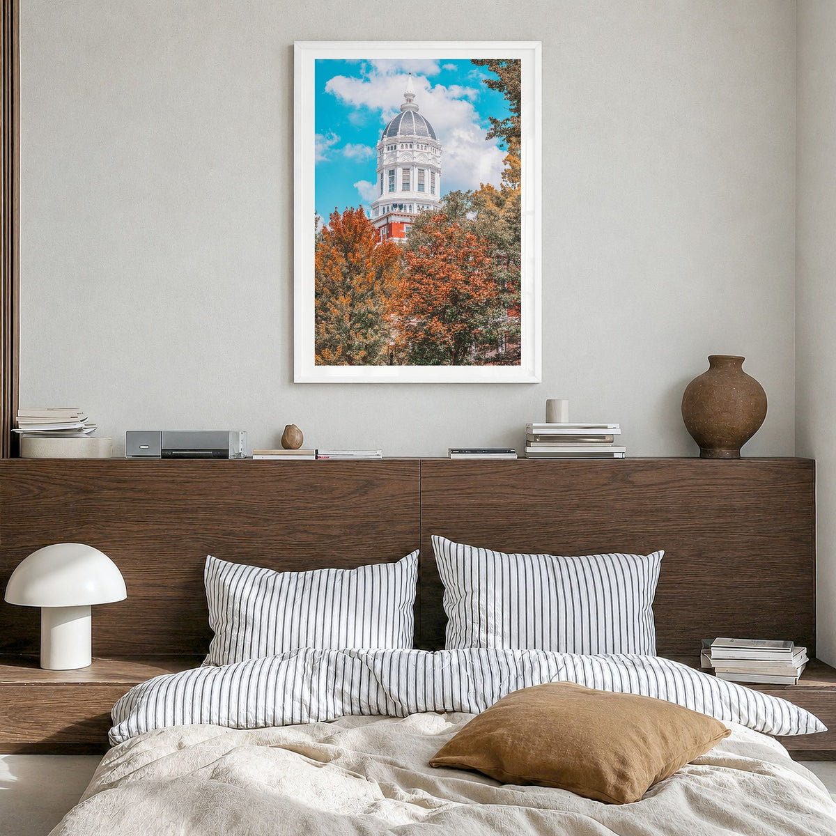 State College Photo Poster in a white wood frame, hanging in a bedroom, white border