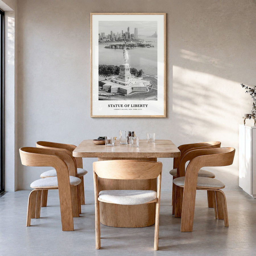 Statue of Liberty Classic Poster in a natural wood frame, hanging in a dining room