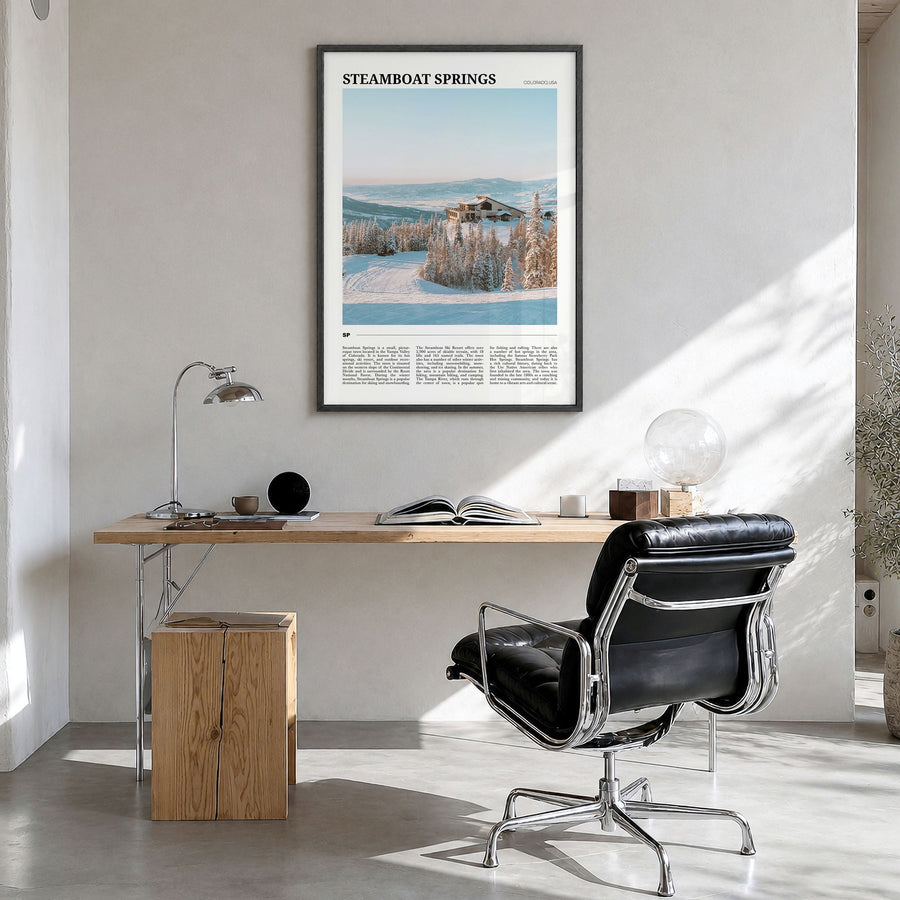 Steamboat Springs Travel Poster in a black wood frame, hanging in a bright home office