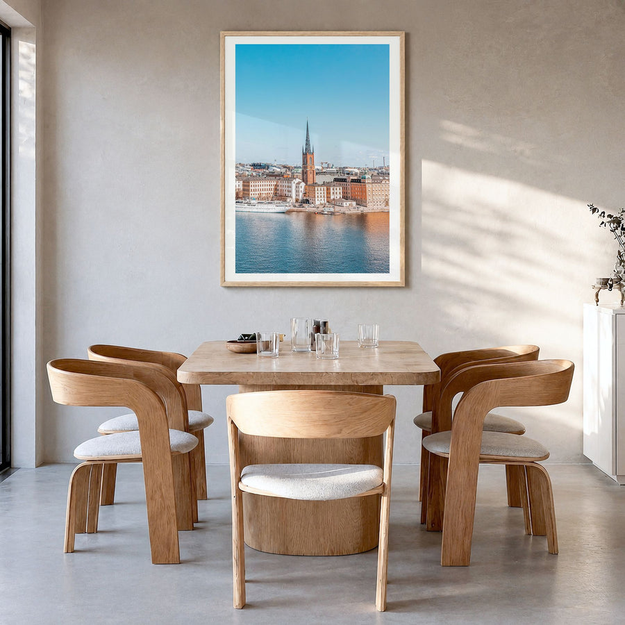 Stockholm Photo No 1 Poster in a natural wood frame, hanging in a dining room, white border