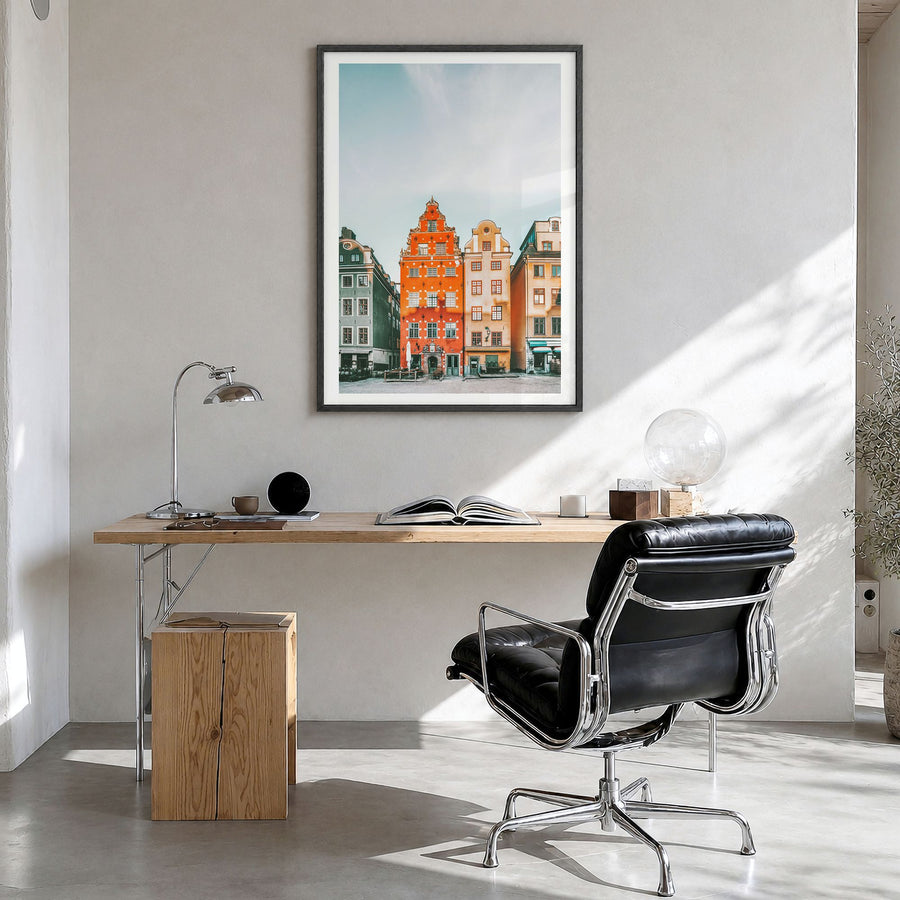 Stockholm Photo No 3 Poster in a black wood frame, hanging in a bright home office, white border