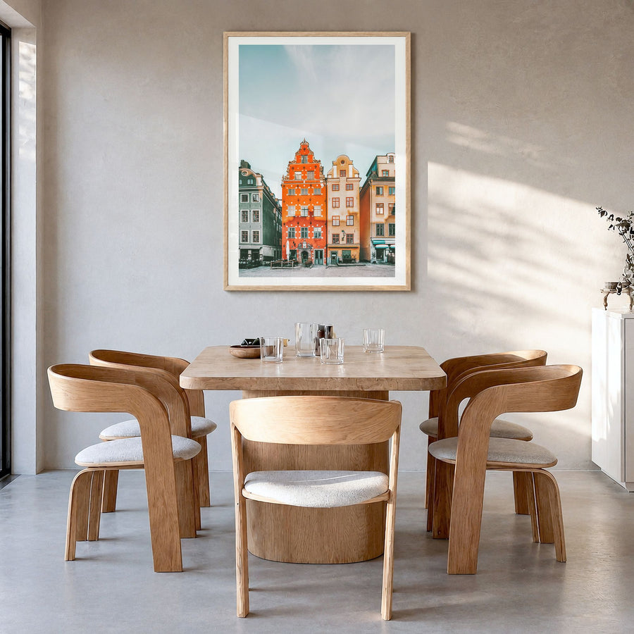 Stockholm Photo No 3 Poster in a natural wood frame, hanging in a dining room, white border