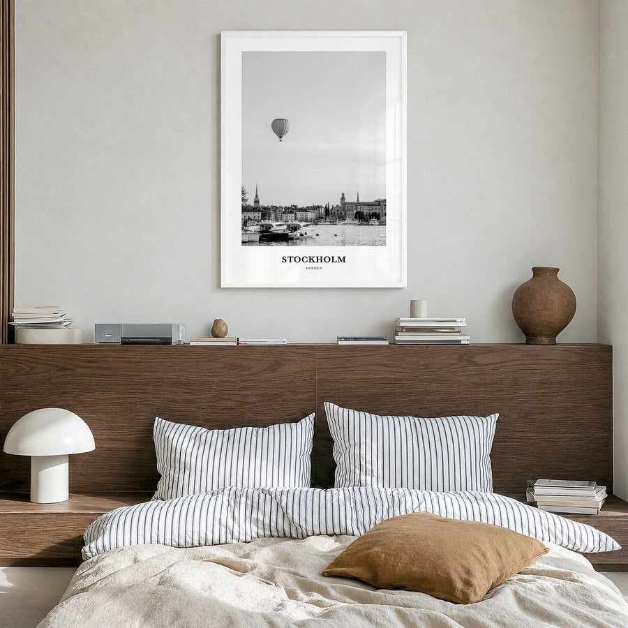 Stockholm Classic No 1 Poster in a white wood frame, hanging in a bedroom