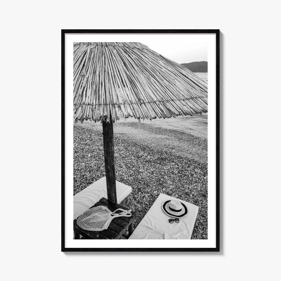 Straw Umbrella black & white photo poster – vertical wall art, unframed print shown in interior mockup