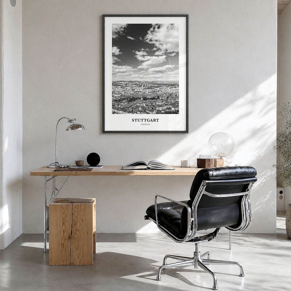 Stuttgart Classic Poster in a black wood frame, hanging in a bright home office