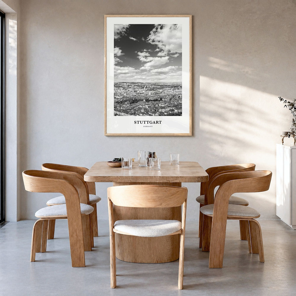 Stuttgart Classic Poster in a natural wood frame, hanging in a dining room