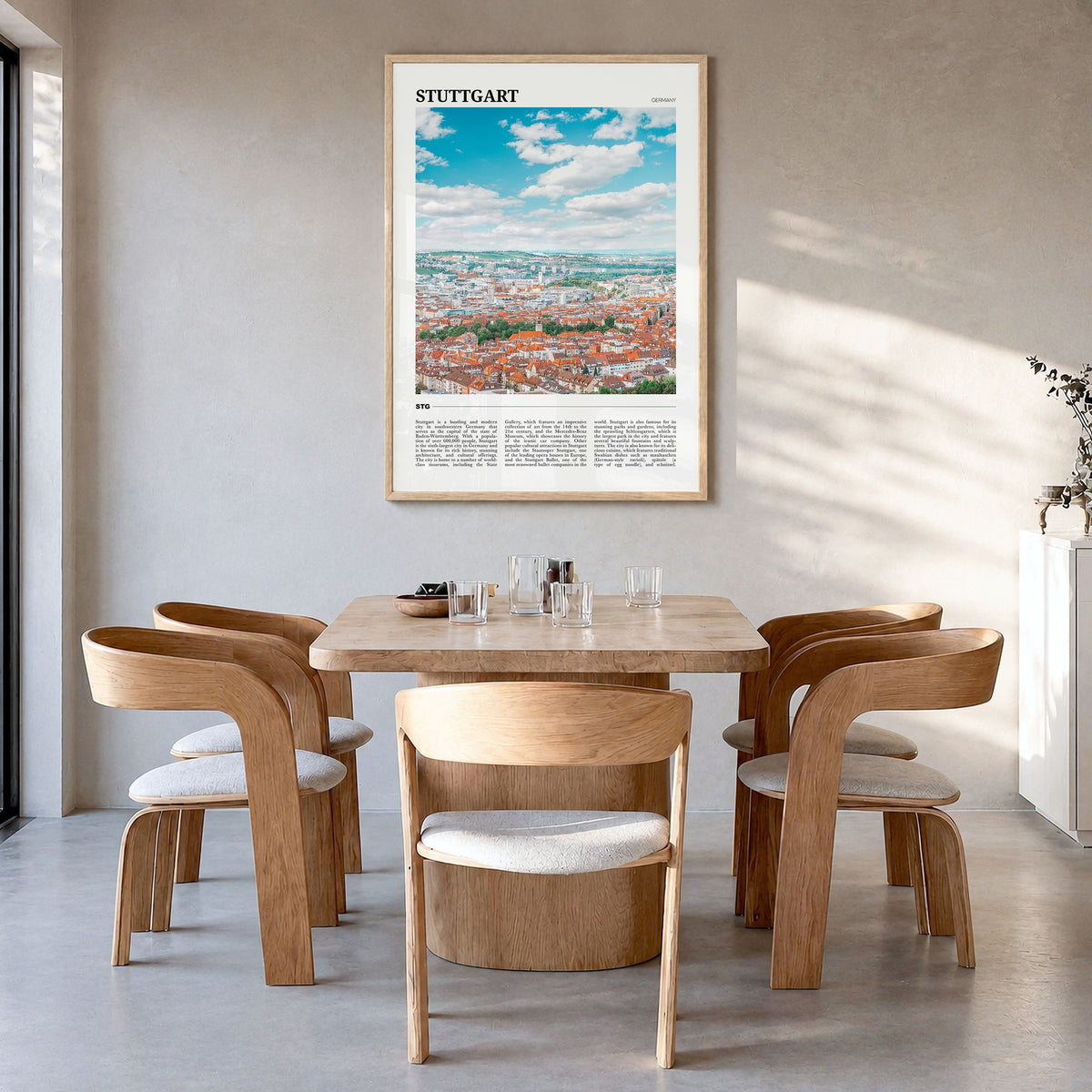 Stuttgart Travel Poster in a natural wood frame, hanging in a dining room