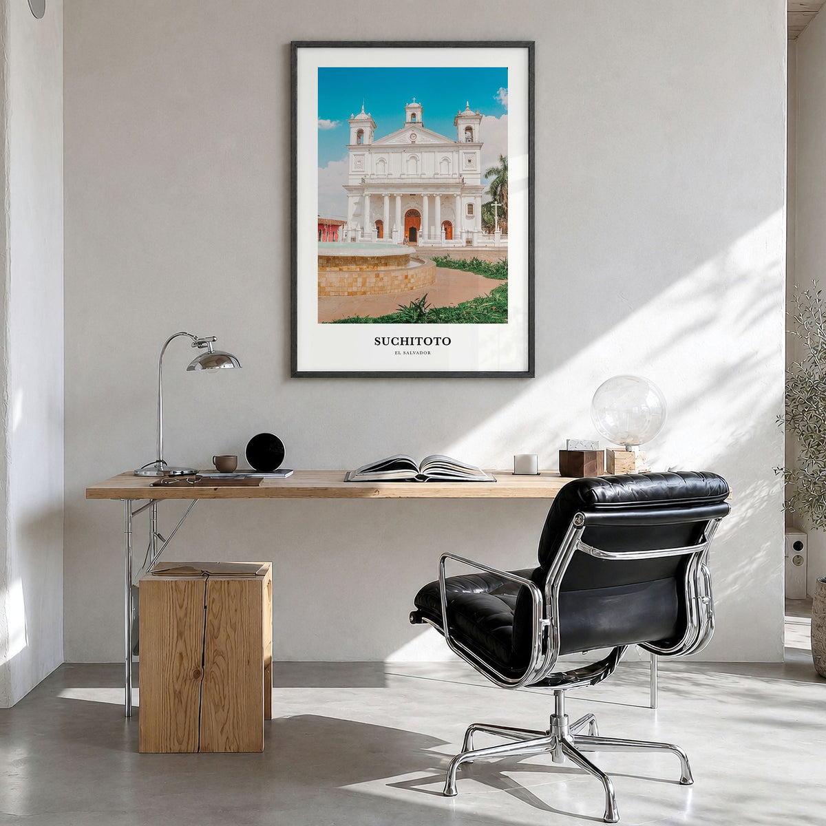 Suchitoto Classic Poster in a black wood frame, hanging in a bright home office
