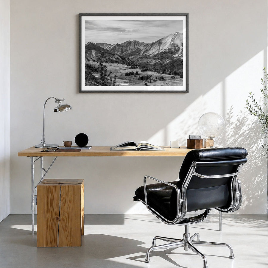 Sun Valley Photo Poster in a black wood frame, hanging in a bright home office, white border