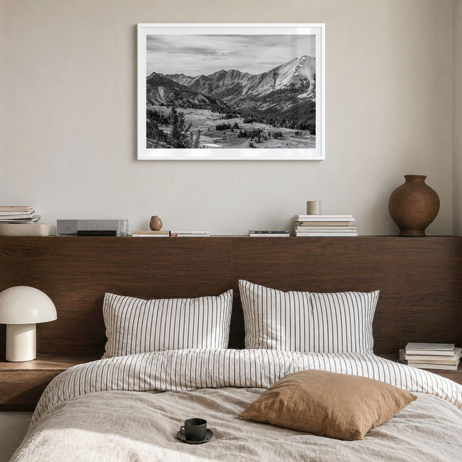 Sun Valley Photo Poster in a white wood frame, hanging in a bedroom, white border