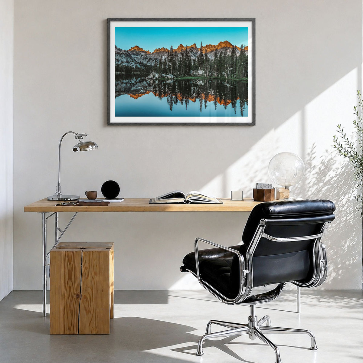 Sun Valley Photo Poster in a black wood frame, hanging in a bright home office, white border