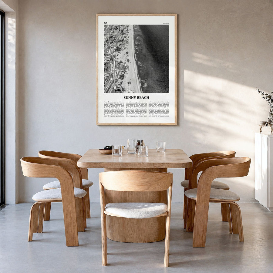Sunny Beach Newspaper Poster in a natural wood frame, hanging in a dining room